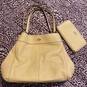 Light yellow Coach purse and matching wallet